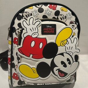 NWT Disney Mickey Mouse Backpack with front pocket and zipper closure.